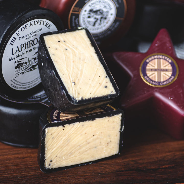 Godminster Cheddar with Truffle Pucks - TOMME Cheese Shop. Delivering really good cheese across Ontario.